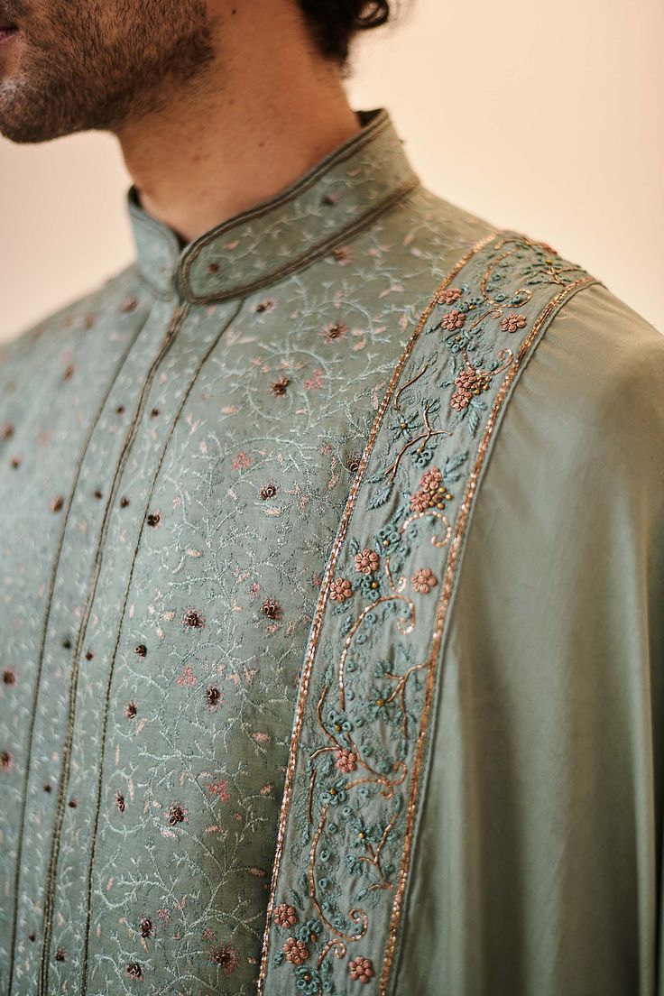 Editor's Note Featuring Jamawar Hand Embroidered Chateau Grey Sherwani. Paired With Tone On Tone Hand Embroidered Dupatta, Kurta, Churidar. Fabric: Linen Silk Color: Grey Component: Sherwani, Stole, Kurta, Churidar Care: Dry Clean Only About the Designer After establishing himself as the leading couturier in the industry of menswear, Jatin Malik went on to explore luxury footwear. You can order online these amazingly designed handmade shoes that are being offered in classy Caligae and Peshawari Grey Sherwani, Green Sherwani, Jatin Malik, Hand Embroidered Dupatta, Embroidered Sherwani, Mens Formal Wear, Embroidered Dupatta, Tone On Tone, Western Wedding