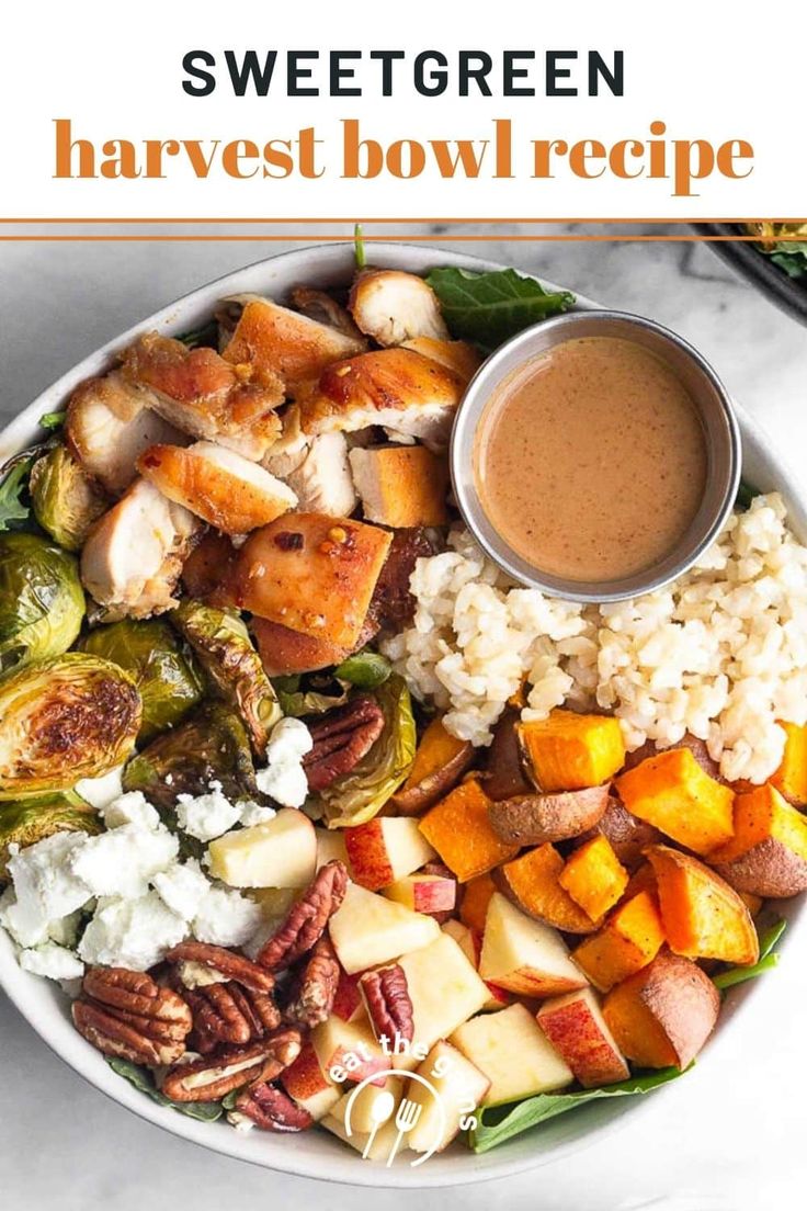 a white plate topped with vegetables and rice next to a bowl of sauce on the side