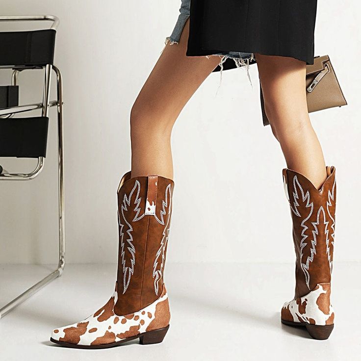 Are you ready to take your style up a notch? With the South Cow Western Boots, you can do just that! These ethical leather boots are made of vegan PU Leather and are the perfect addition to any boho outfit. Specs: Material: PU Leather Fits true to size Bohemian Knee-high Leather Boots, Western Knee-high Martin Boots For Fall, Western Style Knee-high Martin Boots For Fall, Bohemian Snip Toe Boots For Rodeo, Round Toe Knee-high Boots For Western-themed Events In Spring, Knee-high Round Toe Boots For Western-themed Events In Spring, Trendy Ranch Winter Boots, Trendy Winter Ranch Boots, Knee-high Boots With Round Toe For Western-themed Spring Events