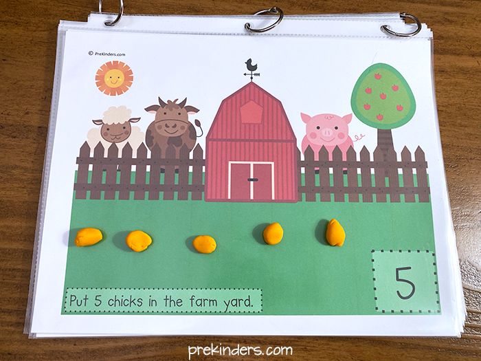 a farm scene with animals and numbers on it