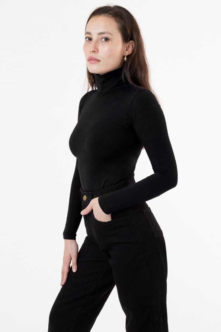 Our classic turtleneck now available in our favorite neutrals and statement bright colors to match our garment dye collection. A tight, fitted turtleneck made of high quality cotton spandex with a full fold-over turtleneck to keep you warm all season long. This top features a mid-length that can still be tucked into high waisted styles and is ideal for layering without adding bulk underneath your favorite sweaters and jackets. We recommend sizing up if you prefer a less fitted look. Please note, Burgundy Dahlia, Classic Turtleneck, Los Angeles Apparel, La Outfits, Turtleneck Style, Garment Manufacturing, Turtleneck T Shirt, Fitted Turtleneck, High Waist Fashion