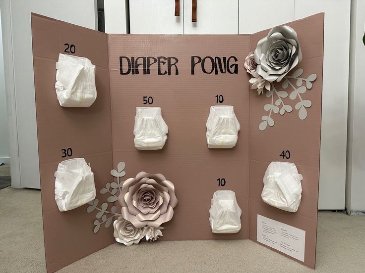 a paper pong board with flowers and diapers on it