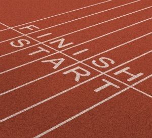 a running track with the words finishing is better than starting