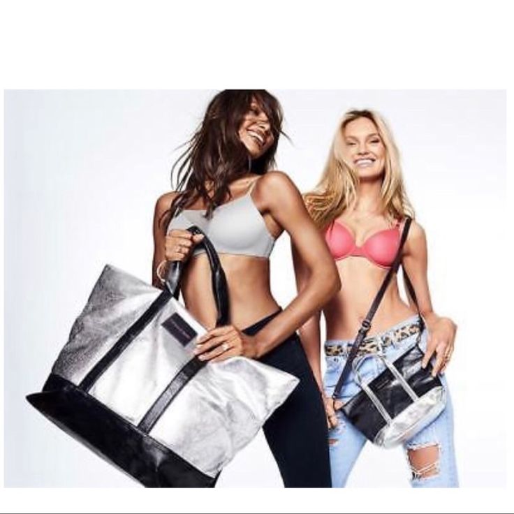 two beautiful women in bikinis holding bags