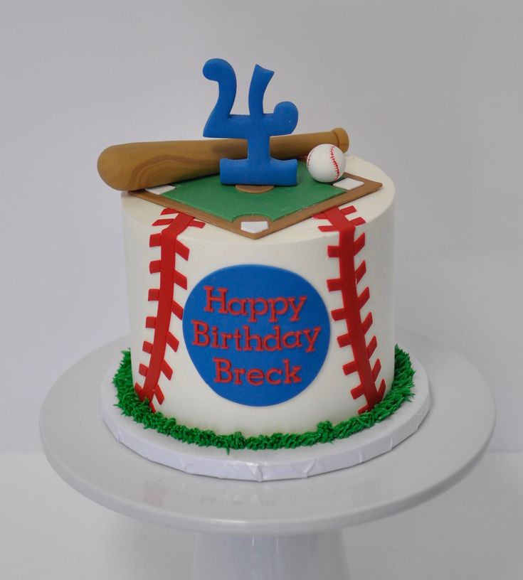 a birthday cake with a baseball and bat on it