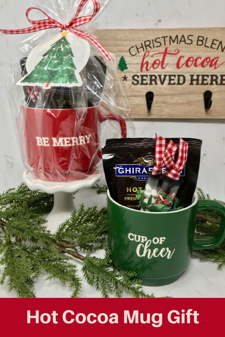 hot cocoa mug gift set with christmas decorations and holiday signs in the background text reads hot cocoa mug gift set