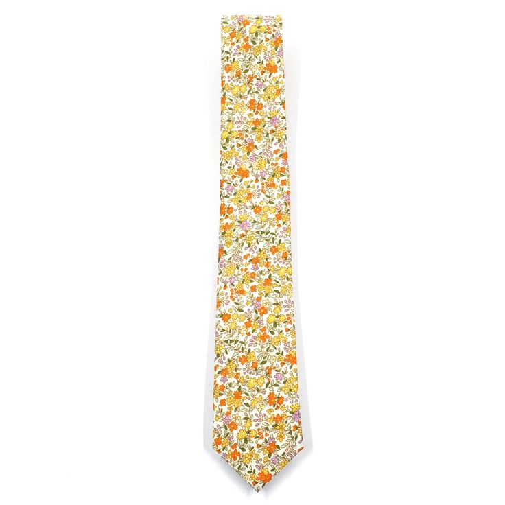 Handmade with 100% imported cotton fabric. Perfect for work, weddings or a night out on the town. This Floral Yellow Field Blossoms Tie will make you feel like the gentleman you aspire to be or accentuate the gentleman you already are. You’ll look good, feel good and do good things in this tie. Makes the perfect gift for a fellow gentleman or for that man in your life by making them look good and feel good. We guarantee your satisfaction with our free refund policy.* Goes Good With: Grey, Navy,