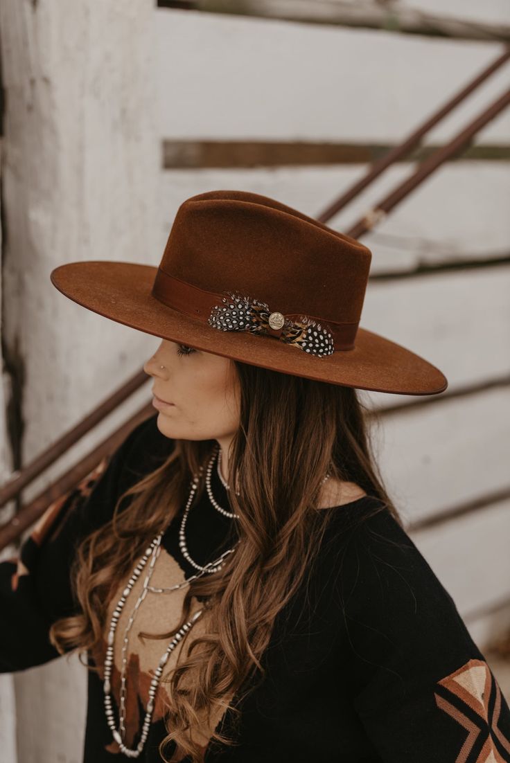 With a wide, flat brim, the Midtown Wide Flat Brim Hat is a rakish hat that, true to its name, exudes city style. Made in Texas from firm high-quality felt, it features a grosgrain ribbon hat band accented by a bold feather accent. On the interior, an absorbent Dri-Lex sweatband ensures it’s as comfortable as it is stylish. Made by Stetson Handmade in Garland, Texas Quality Wool Felt Center Pinch Front Crown Grosgrain Hatband Dri-Lex Sweatband Satin Liner Brim: 3 3/4” Crown: 4 1/2” Curved Brim Fur Felt Top Hat For Fall, Fall Top Hat With Curved Brim In Fur Felt, Fall Season Fur Felt Top Hat With Curved Brim, Fur Felt Top Hat With Curved Brim For Fall, Wide Brim Fur Felt Top Hat For Fall, Fall Flat Brim Top Hat, Womens Felt Cowboy Hat, Fall Fur Felt Boater Hat With Flat Crown, Western Style Flat Brim Top Hat For Fall