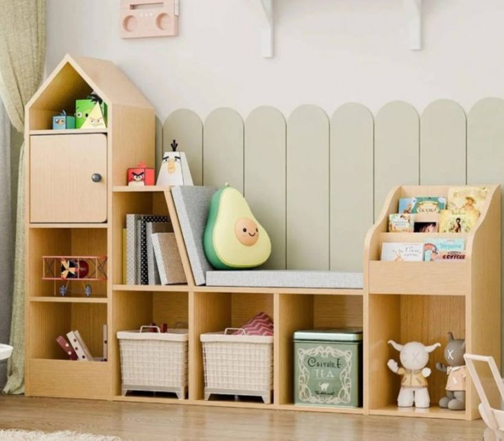 a child's room with toys and bookshelves