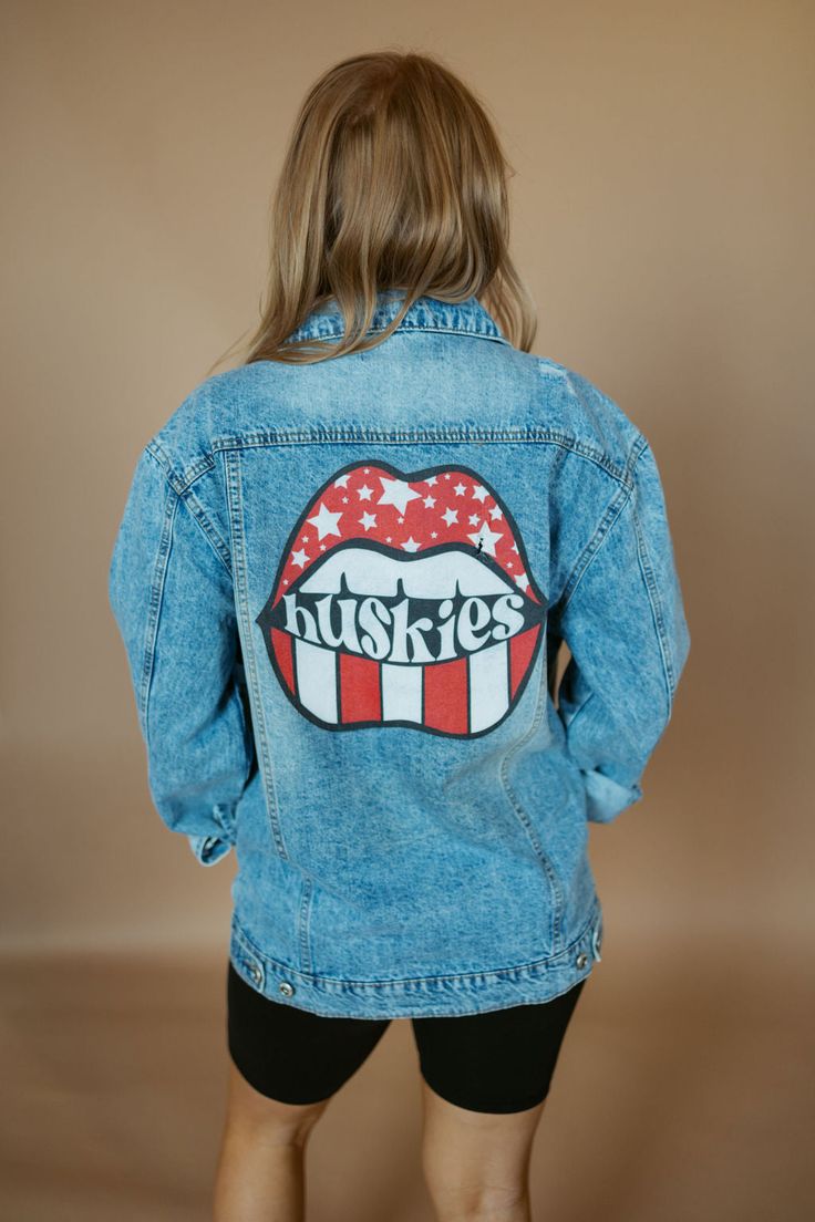 Huskies Lips Distressed Denim Jacket | RTS-Jacket-Sister Shirts-Sister Shirts Trendy Denim Jacket With Patches, Trendy Oversized Denim Jacket With Graphic Print, Trendy Denim Jacket With Graphic Print For Fall, Trendy Relaxed Fit Outerwear With Graphic Print, Casual Medium Wash Denim Jacket With Graphic Print, Casual Medium Wash Outerwear With Graphic Print, Trendy Graphic Print Denim Jacket, Trendy Acid Wash Denim Jacket, Trendy Acid Wash Denim Jacket For Fall