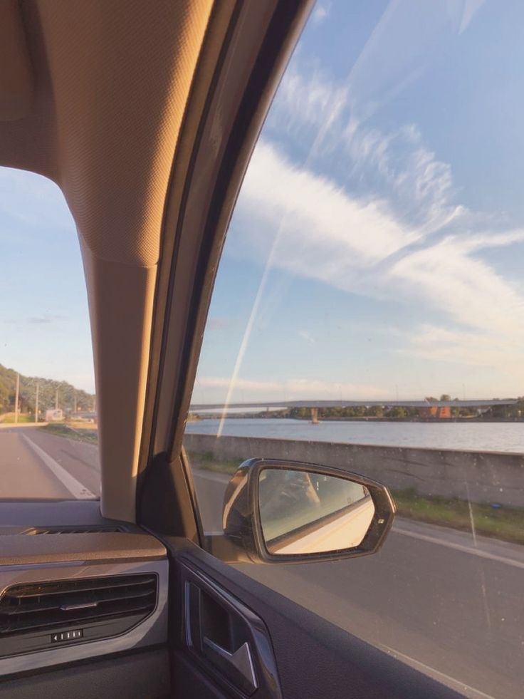 the view from inside a car looking at water