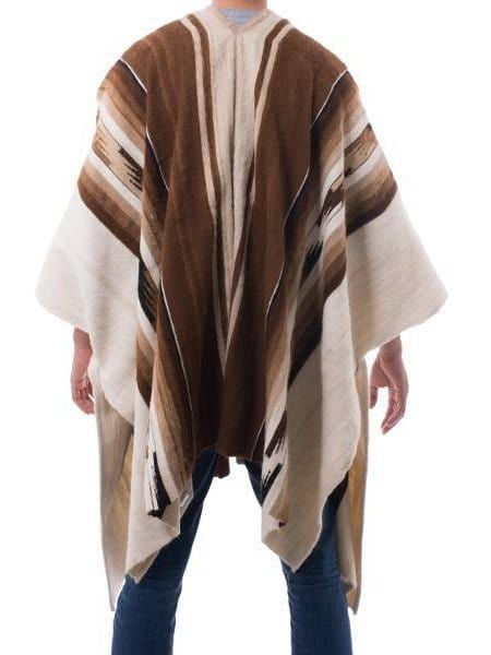 Warm shades of tan, brown and ivory exalt the fertile Andean earth. Working in luxurious alpaca, Faustino Maldonado creates a men's poncho with pre-Hispanic motifs. The warm but lightweight garment is woven on the hand loom. Brown Long Sleeve One-size Cape, Traditional Brown Winter Cape, Brown Alpaca Winter Cape, Brown Alpaca Poncho For Winter, Brown Alpaca Shawl For Fall, Traditional Brown Cape For Fall, Traditional Brown Poncho For Festival, Brown One Size Cape, Bohemian Brown Cape Outerwear