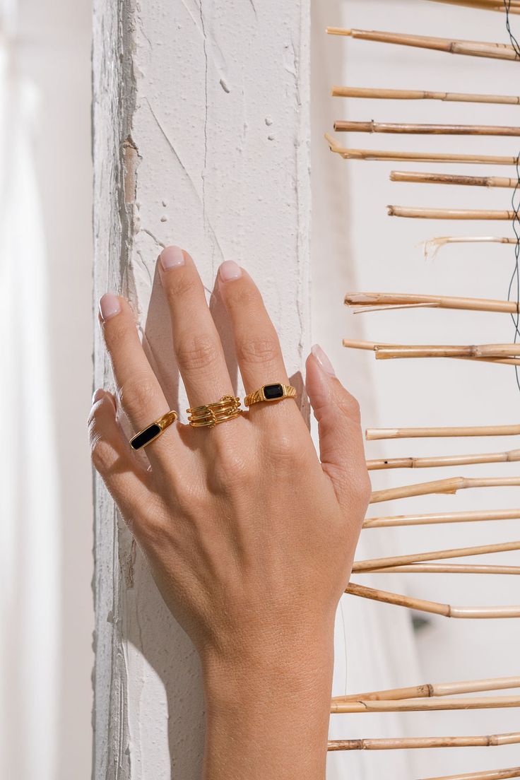 PRODUCT DETAILS: Water Resistant 💧 METAL: 18K gold over stainless steel. SIZE: Wide. Hypoallergenic. DESIGNER NOTE Introducing the black stone version of one of our favorites. This classic color combination is sure to match any outfit for any occasion. STYLE TIP: Stack this ring with the Chain Ring for a sophisticated look. Sleek Ring Jewelry Gift, Sleek Ring Jewelry For Gift, Timeless Black Stackable Jewelry, Minimalist Black Tarnish Resistant Rings, Modern Black Enamel Open Ring Jewelry, Minimalist Black Tarnish-resistant Rings, Luxury Black Tarnish-resistant Ring, Modern Black Enamel Open Ring, Sleek Gold Rings For Everyday Wear