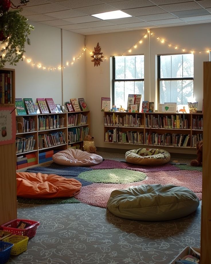 a room filled with lots of books and bean bag chairs