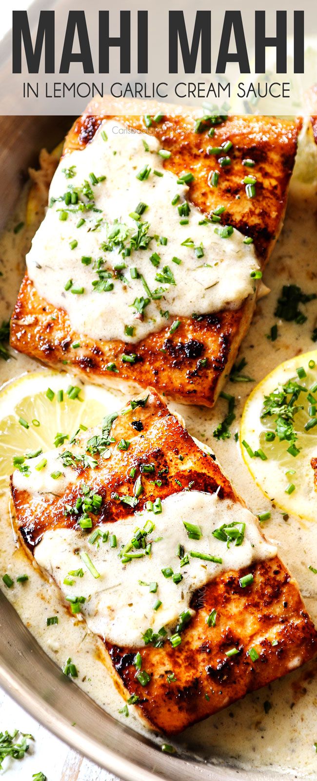 grilled salmon with lemon cream sauce in a pan