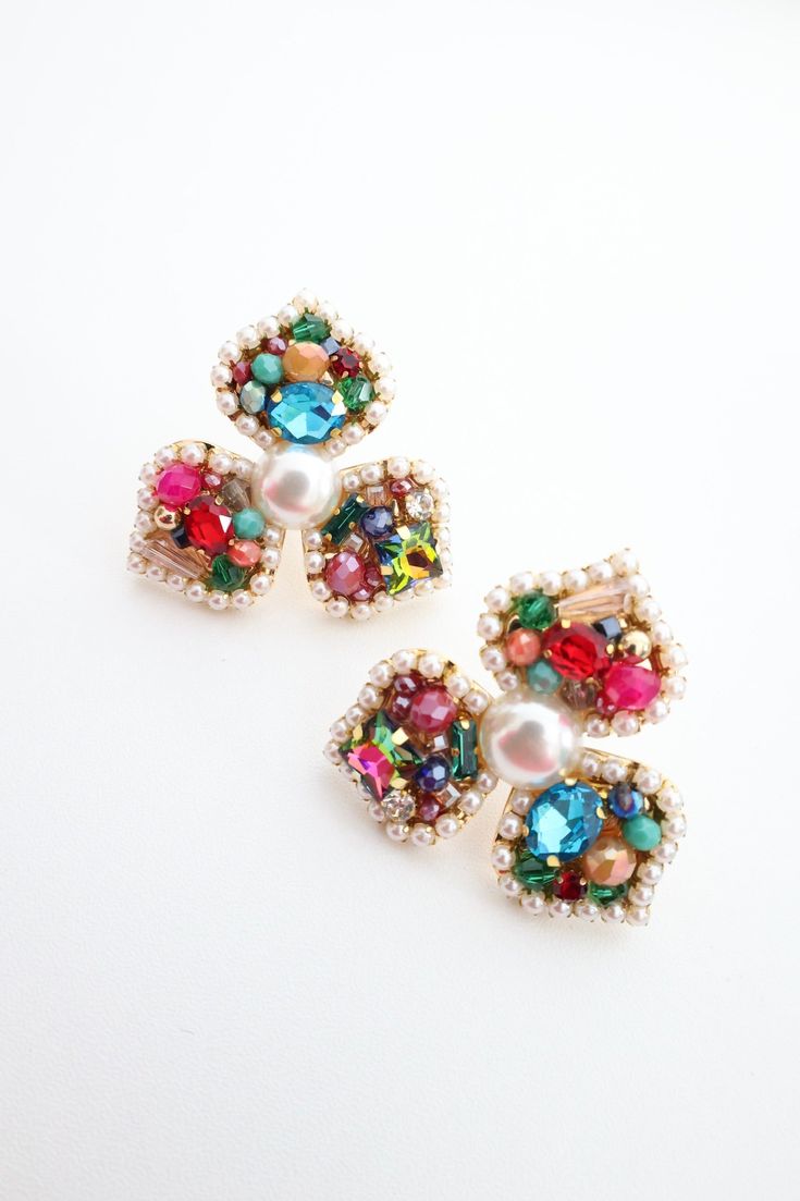 Postback Beaded earring with pearl center Pearl Jeweled Earrings For Party, Pearl Beaded Earrings For Party, Beaded Drop Clip-on Earrings For Party, Beaded Pearl Earrings For Party, Party Pearl Earrings With Beaded Detail, Elegant Multicolor Beaded Earrings For Pierced Ears, Elegant Flower Earrings With Colorful Beads, Elegant Multicolor Beaded Earrings, Colorful Beads Pearl Earrings