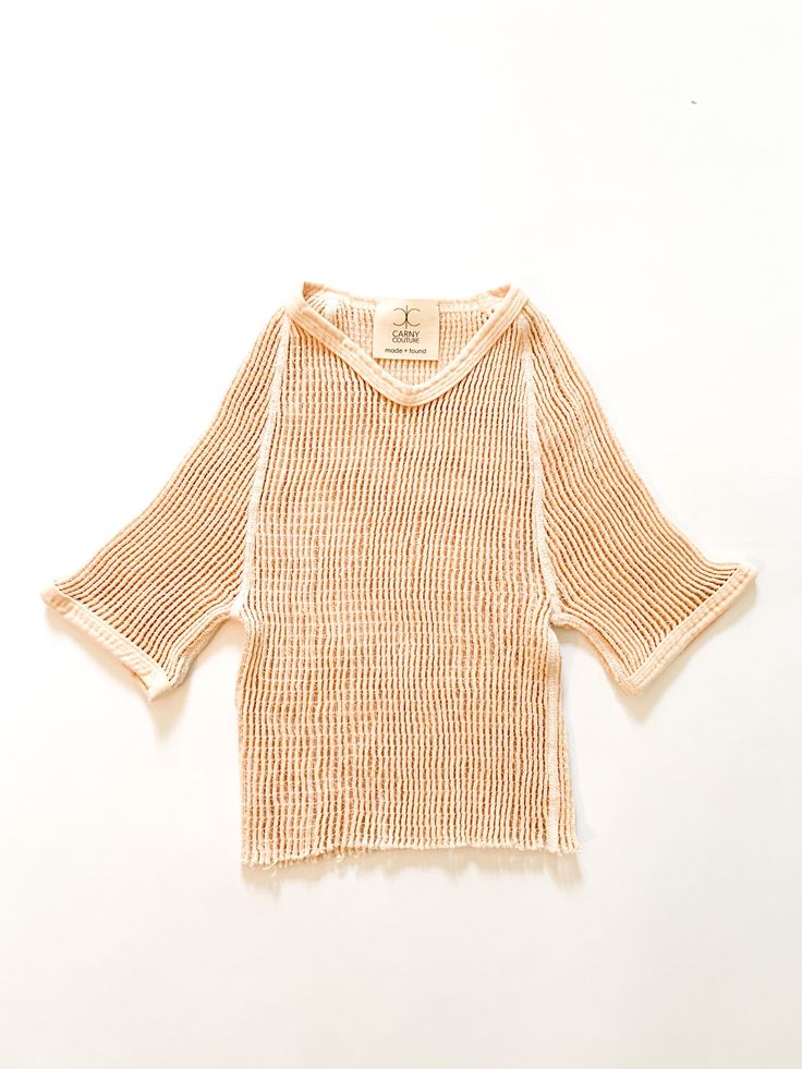 Cropped net layering short sleeve top. Fabric: Cotton and elasticLabel: Carny Couture FoundFit: XS/S Measurements: Bust 24-34" Sleeve (from collar) 11.5" Length (natural) 16" Length (peach) 16.5" Waist 24-34" Condition: Excellent Beige Half Sleeve Blouse For Summer, Cream Half Sleeve Tops For Spring, Summer Stretch Open Knit Tops, Summer Open Knit Beige Top, Half-sleeve Tops For Summer Layering, Summer Half Sleeve Tops For Layering, Half Sleeve Tops For Summer Layering, Beige Open Knit Top For Summer, Short Sleeve Open Knit Top