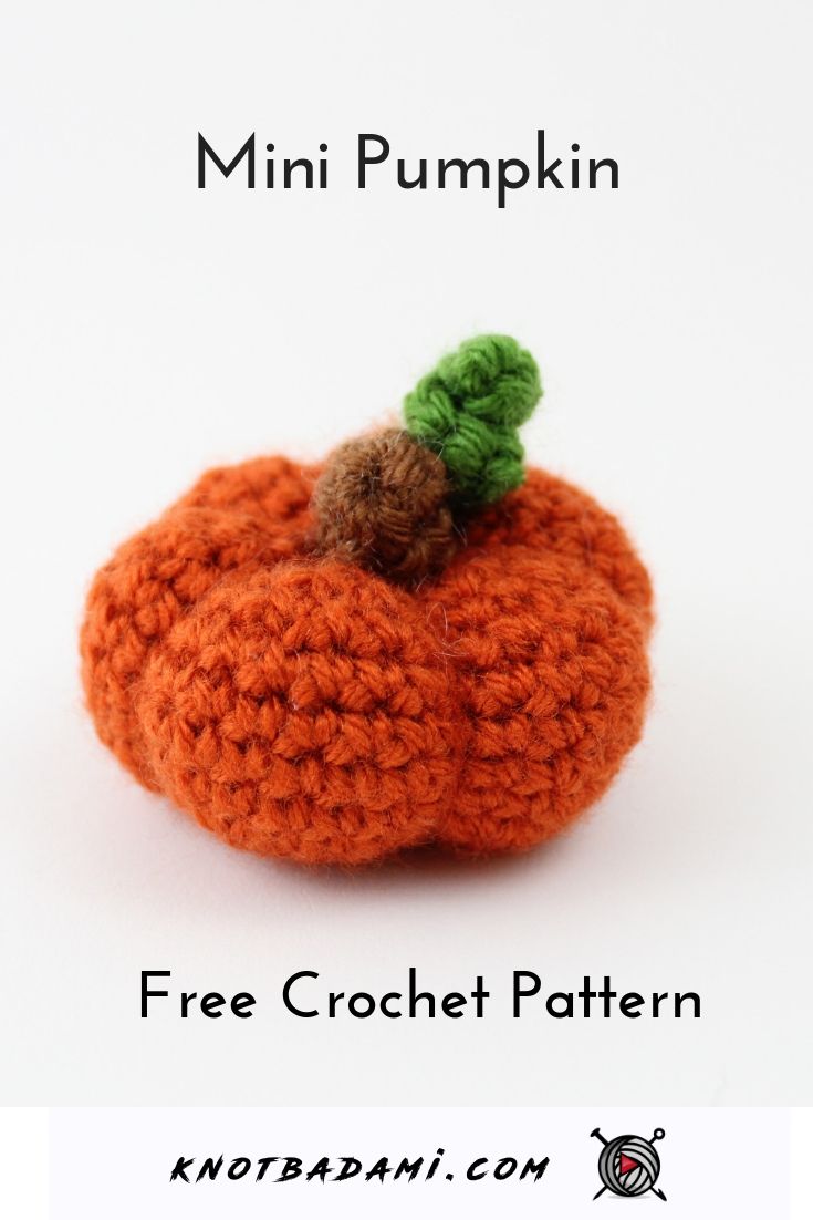 an orange crocheted pumpkin with a green leaf on it's top and the words, mini pumpkin free crochet pattern