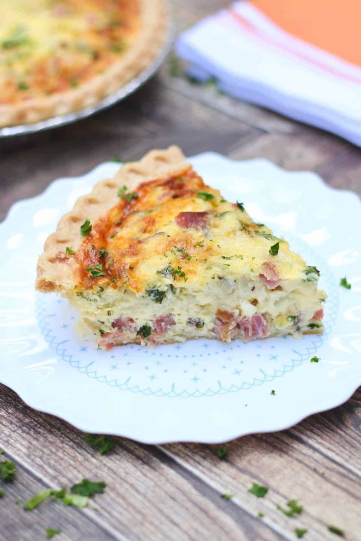 a slice of quiche on a plate