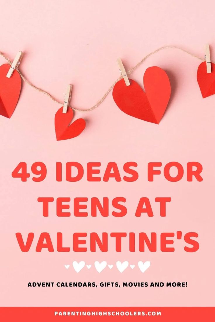 valentine's day card with red paper hearts hanging from clothes pins on a pink background