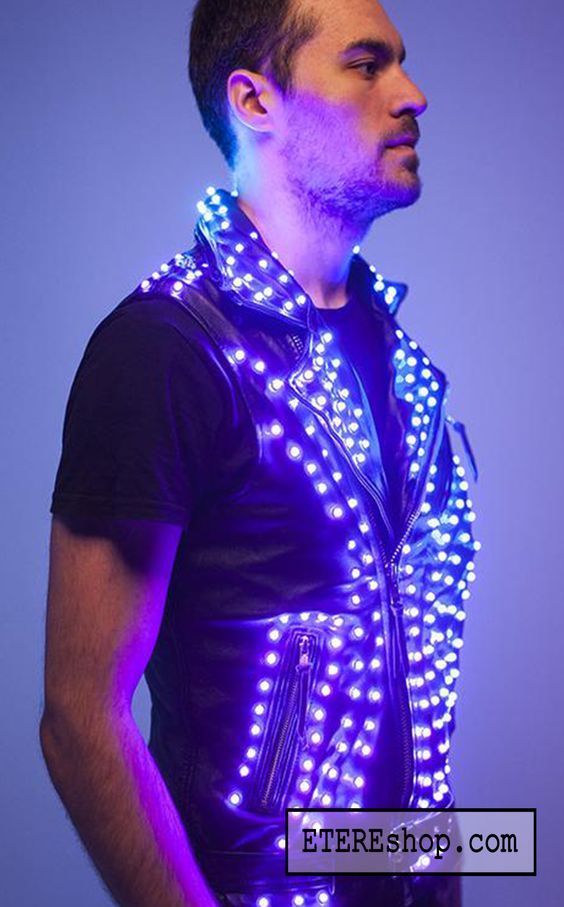 a man wearing a vest with lights on it