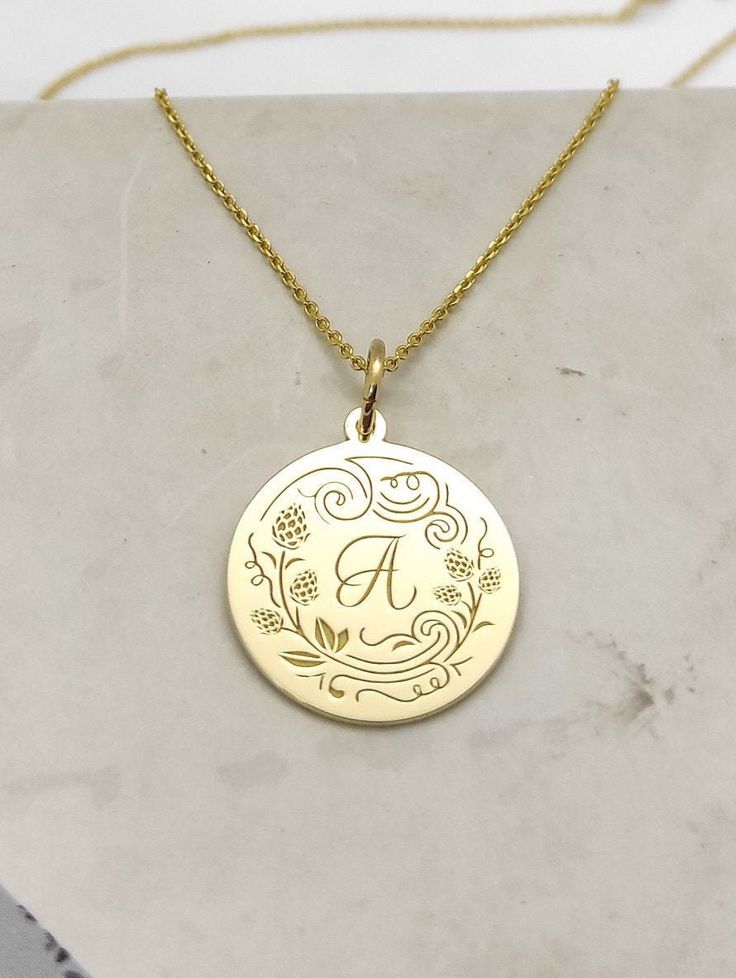 All parcels are shipped in one business day! For a speedy delivery to your address please select the upgraded shipping with a small extra cost. Engraved Initials Design Necklace - Initials Pendant Necklace - Handmade Initials Gold Jewelry - Engraved Initials Gold Necklace Engraved Initials Pendant Necklace made out of 14K Solid Gold. Available only in Yellow Gold finish. An elegant piece of jewelry that is a perfect gift to yourself and your loved ones. Charm Thickness: 0.5mm Jump Ring inner dia Initial Engraved Necklace, Yellow Gold Medallion Necklaces With Engraving Option, Yellow Gold Medallion Necklace With Engraving Option, Personalized Yellow Gold Medallion Jewelry, Personalized Yellow Gold Pendant Necklace, Yellow Gold Custom Pendant Necklace For Personalized Gift, Custom Yellow Gold Pendant Necklace For Personalized Gift, Gold Charm Necklaces With Engraving Option, Gold Round Charm Necklaces With Engraving Option