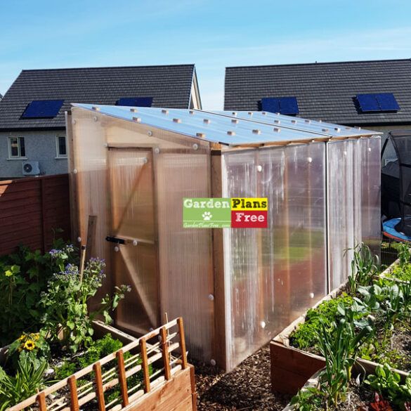 there is a small garden shed in the yard with plants growing inside it and a sign that says garden planet