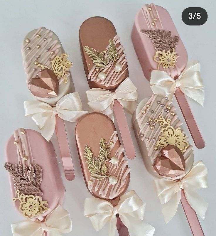 six pairs of pink and gold shoes with bows on them, all decorated in different designs