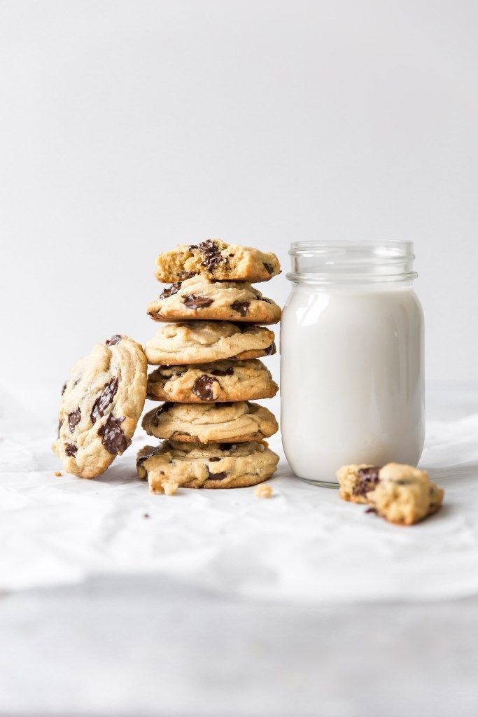 chocolate chip cookies and milk on a table