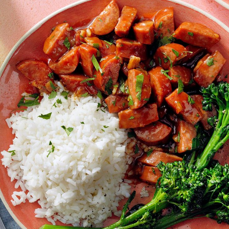 a plate with rice, broccoli and chicken on it