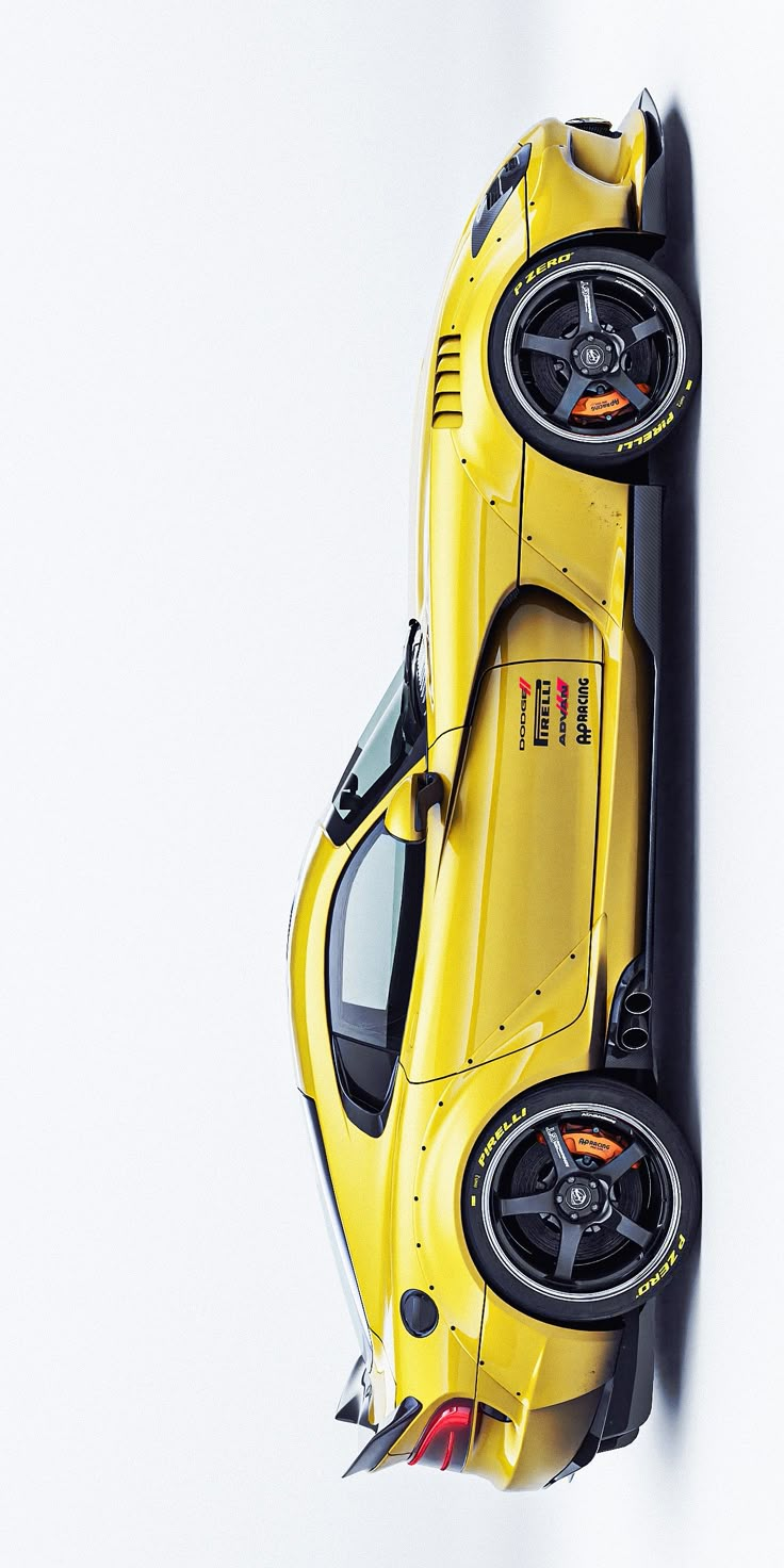 a yellow sports car is shown from above