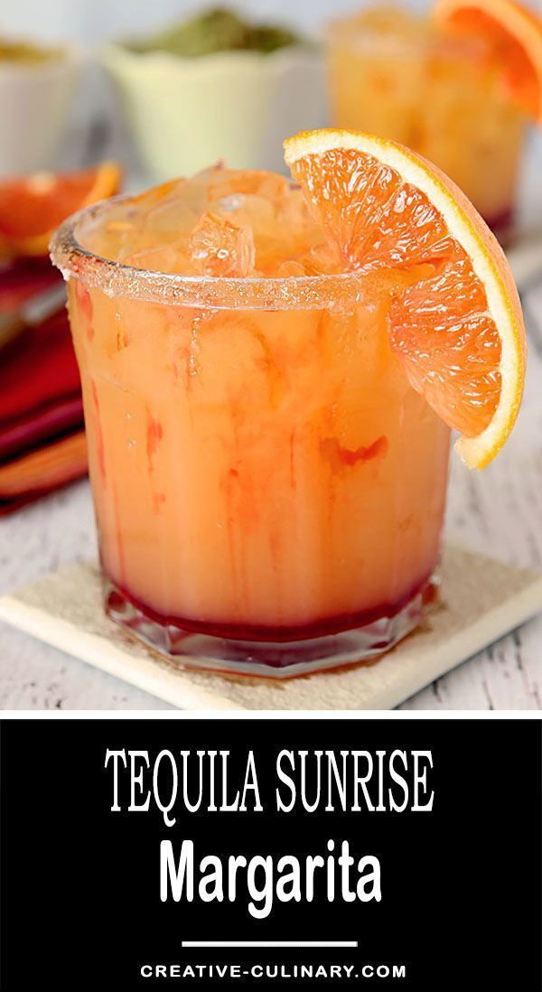 tequila sunrise margarita with orange slices and garnish