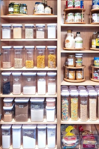 a pantry filled with lots of food and storage containers on shelves next to each other