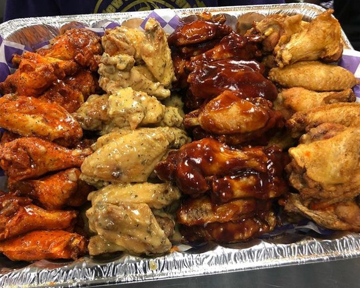 chicken wings covered in bbq sauce on top of tin foil