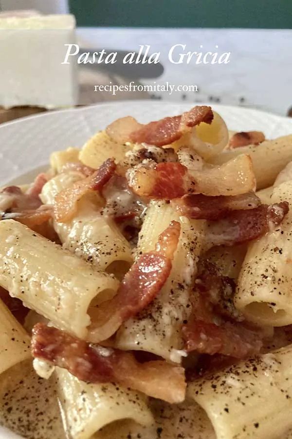 pasta with bacon and cheese on a white plate