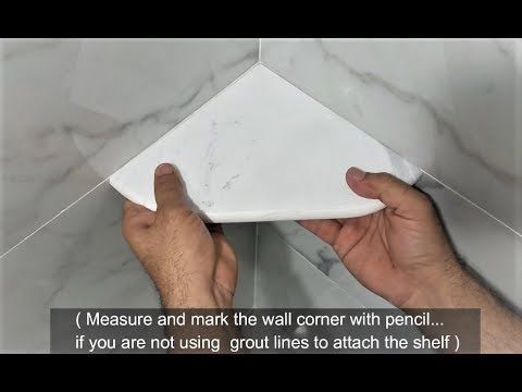 a person is holding a piece of paper in front of a tile wall with the words measure and mark the wall corner with pencil if you are not using grout lines to attach