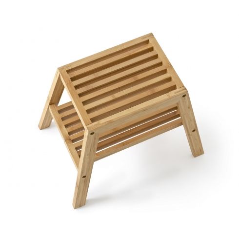 a wooden stool sitting on top of a white floor