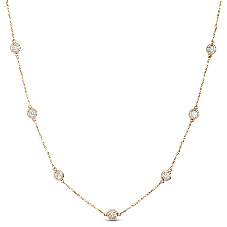 Bezel set round diamonds are dispersed symmetrically across a delicate chain in this station design necklace. Classic Round Station Necklace With Adjustable Chain, Diamond Station Necklace With Delicate Chain, Elegant Bezel Setting Station Necklace, Elegant Bezel Set Station Necklace, Dainty Station Necklace With Diamond Accents For Formal Events, Classic Diamond Station Necklace With Delicate Chain, Elegant Round Station Necklace With Single Cut Diamonds, Fine Jewelry Round Station Necklace With Delicate Chain, Formal Cubic Zirconia Station Necklace