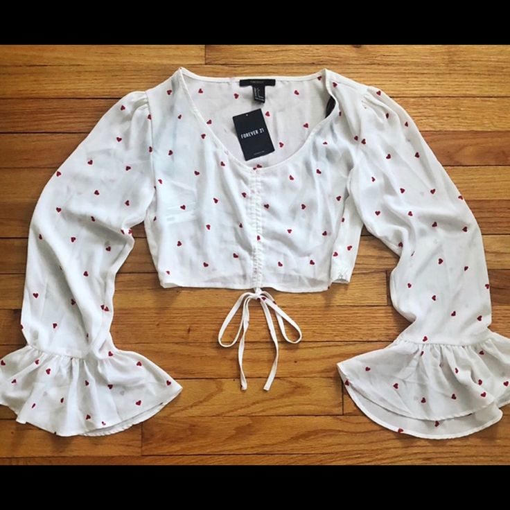 Be Flirty In This Light Weight Too! The Top Features Red Hearts All Over With Flirty Bell Sleeves! Top Features A Side Zipper For Convenience. Never Worn! Forever 21 Long Sleeve Summer Crop Top, Forever 21 Long Sleeve Crop Top For Summer, Chic Fitted Top With Heart Print, Chic Fitted Heart Print Tops, Casual Fitted Blouse With Heart Print, White Heart Print Blouse For Summer, Summer White Blouse With Heart Print, Fitted Summer Blouse With Heart Print, Fitted Heart Print Blouse For Summer