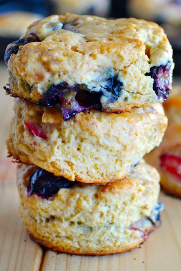 three blueberry muffins stacked on top of each other