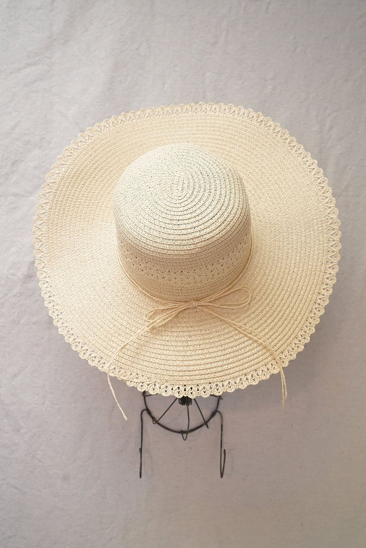 Vintage inspired wide brimmed straw hat. Hat features round crown, soft straw, and a matching ribbon trim along with lace trim. Inner crown features ties to adjust for head size. Product Details measurements: one size Brim- 4.72in Circumference- 23in material: straw imported Summer Hats With Crochet Trim, Summer Beach Sun Hat With Ribbon, Summer Straw Hat With Ribbon For Vacation, Summer Straw Hat With Ribbon For Beach, Spring Vacation Sun Hat With Ribbon, Spring Sun Hat With Crochet Trim And Curved Brim, Vacation Straw Hat With Ribbon And Short Brim, Vacation Wide Brim Sun Hat With Ribbon, Spring Vacation Straw Hat With Ribbon