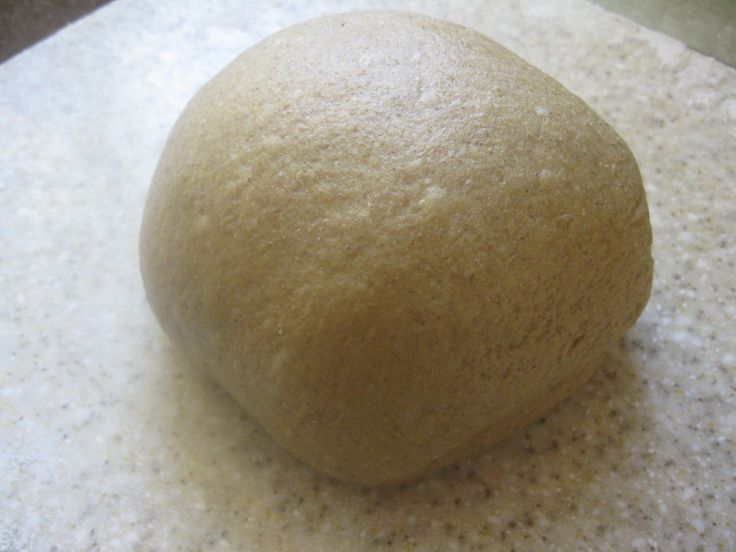 a ball of dough sitting on top of a counter