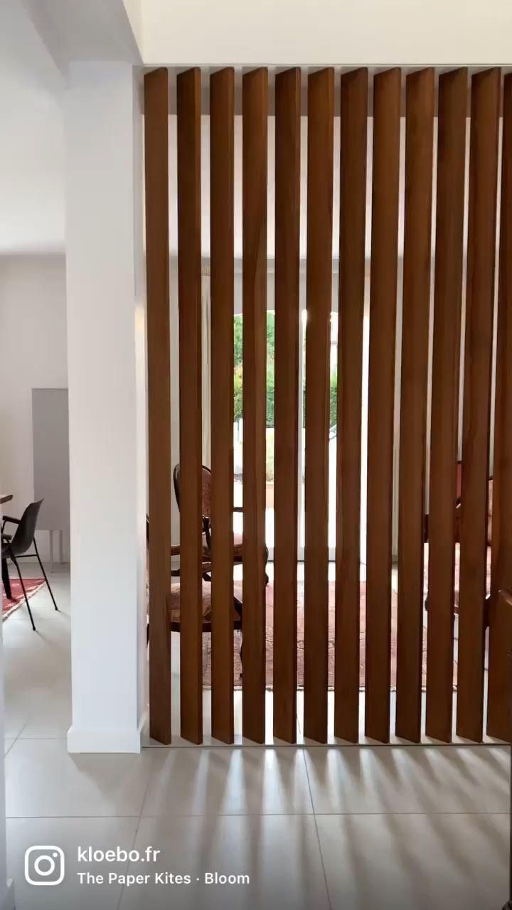 an open room with wooden slats on the wall