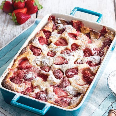 strawberry cobbler with powdered sugar and fresh strawberries