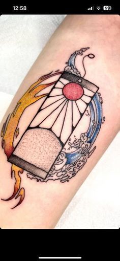 a tattoo on the arm of a person with a birdcage and flames coming out of it