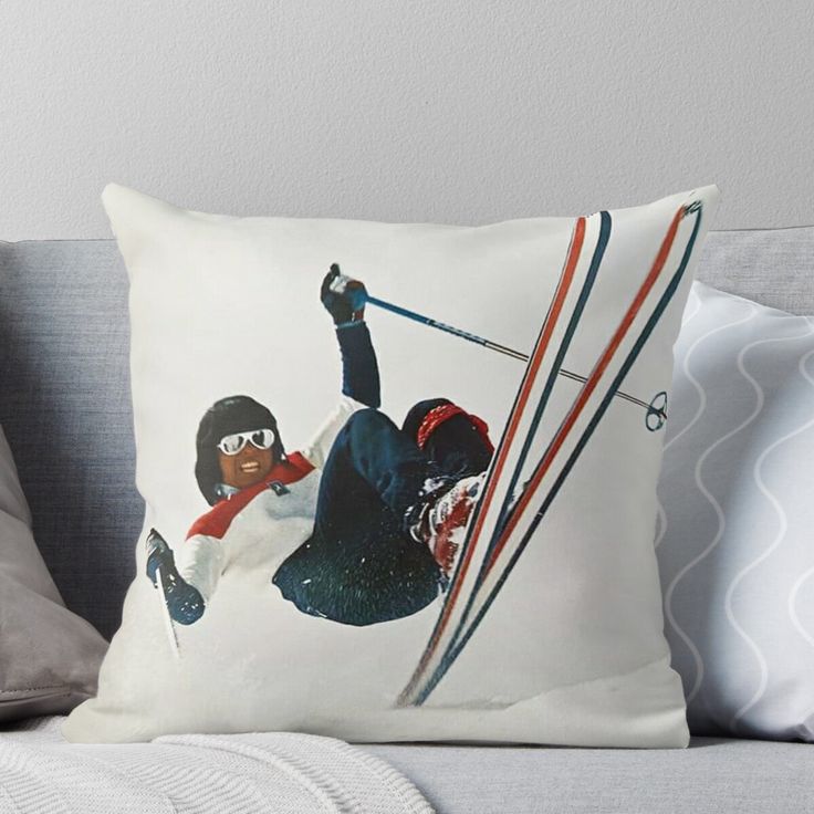 a person on skis jumping in the air throw pillow