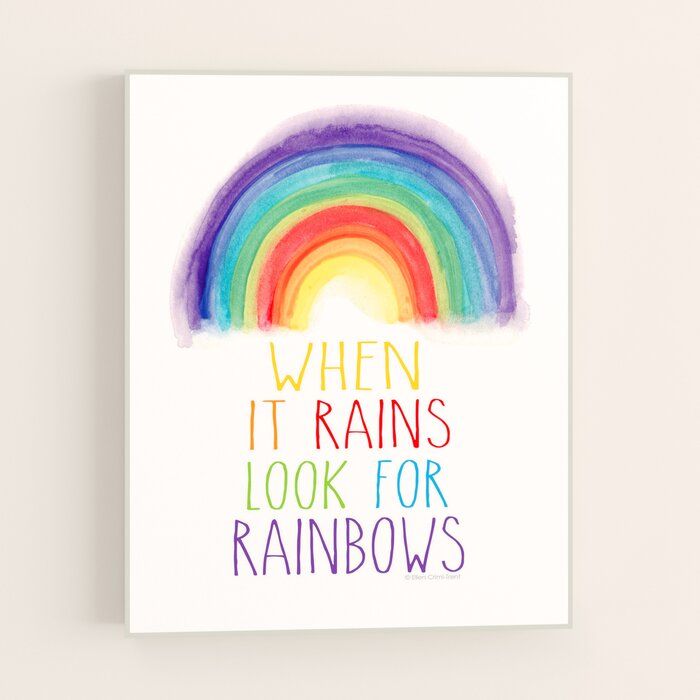 a rainbow with the words when it rains, look for rainbows on it's side