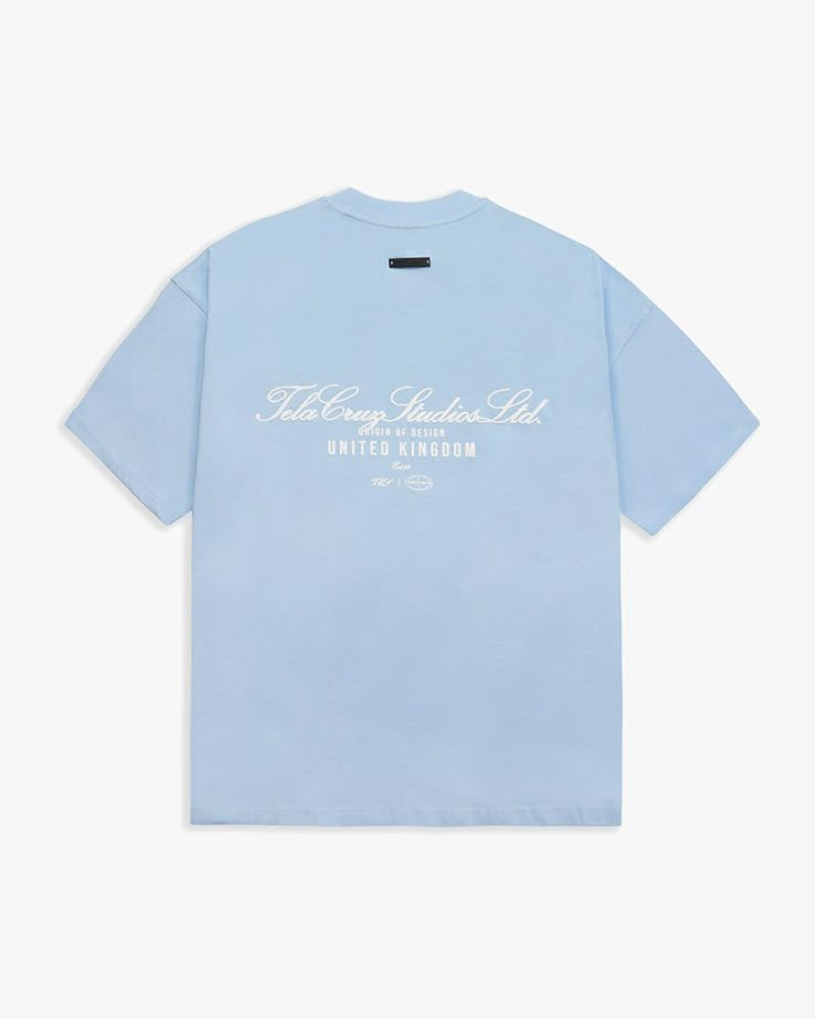 Tela Cruz Studios Ltd Placid Blue relaxed fit T Shirt in a heavyweight cotton. Designed with the essence of comfort and fit in mind, we've delivered and outstanding product for our debut franchise. Inspired by Modern Luxury Streetwear and everyday use. Puff Screen Print will naturally age giving a more worn, vintage feel over time, enhancing the character of the garment. Details 220 GSM 100% Cotton Dyed To Custom Pantone Boxy Dropped Shouldered Fit 2x2 Ribbed Collar Embossed Leather Tag On Back White Graphic Tee, Garment Details, Leather Tag, Xmas List, Swag Shoes, Blue Tshirt, Luxury Streetwear, Screen Print, Modern Luxury