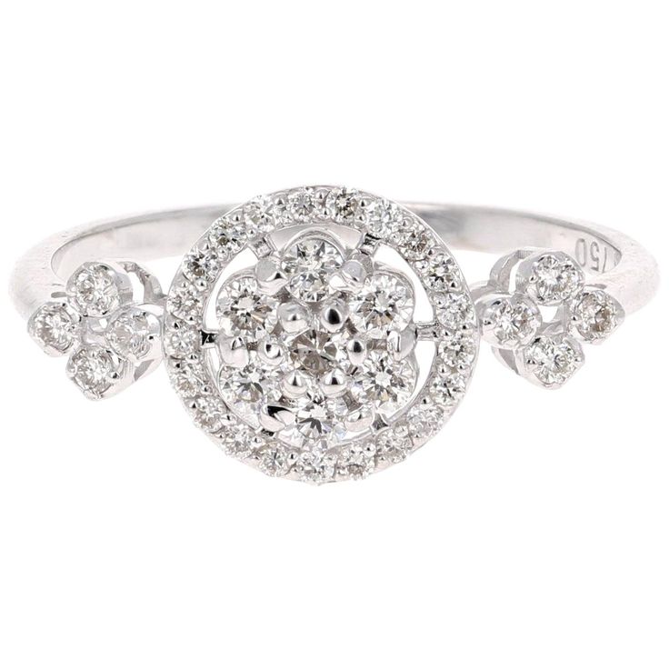 A cute and dainty diamond cluster ring! The ring has 36 Round Cut Diamonds that weigh 0.43 Carats. The clarity and color of the diamonds are VS2-H. It is set in 18K White Gold and is 2.3 grams. The ring size is a 6.5 and can be resized if needed at no cost. Unique Ring Designs, Gold Cocktail Ring, Cluster Rings, Wedding Rings Unique, Rich Man, Diamond Cluster Ring, White Gold Ring, Diamond Cluster, Cluster Ring