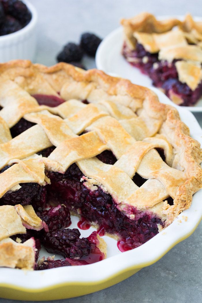 blueberry pie with latticed crust on white plate